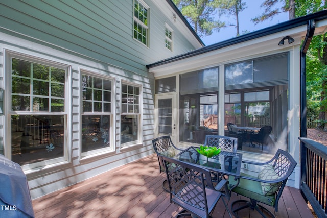 405 Widdington Ln, Cary, NC 27519 - wooden deck with outdoor dining space and a sunroom