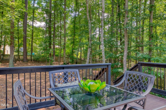 405 Widdington Ln, Cary, NC 27519 - wooden deck featuring outdoor dining area and a fenced backyard