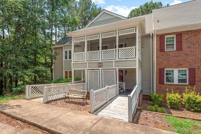 106 Choptank Ct Unit B-2, Cary, NC 27513 - view of front facade with a porch, brick siding, and roof with shingles