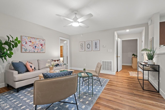 106 Choptank Ct Unit B-2, Cary, NC 27513 - living room featuring ceiling fan, light wood-style flooring, and baseboards