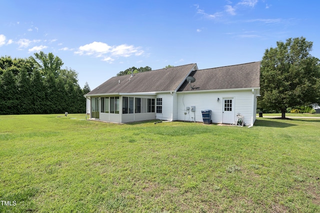 3705 Highland Creek Dr, Apex, NC 27539 - rear view of property featuring a sunroom, a lawn, and roof with shingles