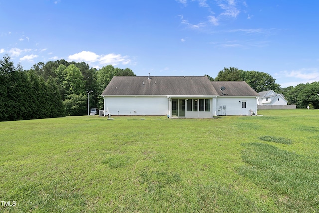 3705 Highland Creek Dr, Apex, NC 27539 - back of property featuring a lawn and a sunroom