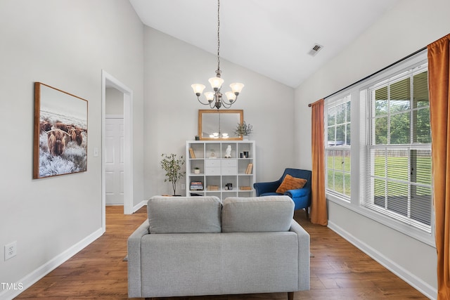 3705 Highland Creek Dr, Apex, NC 27539 - living area with a chandelier, wood finished floors, baseboards, and high vaulted ceiling