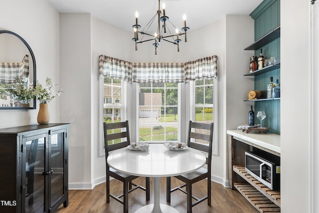 3705 Highland Creek Dr, Apex, NC 27539 - dining area with baseboards, a chandelier, and dark wood finished floors