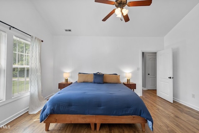 3705 Highland Creek Dr, Apex, NC 27539 - bedroom with lofted ceiling, baseboards, wood finished floors, and a ceiling fan