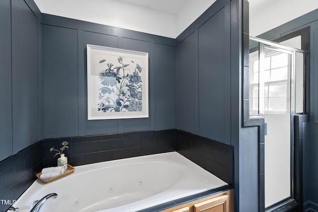 3705 Highland Creek Dr, Apex, NC 27539 - bathroom featuring a stall shower, a whirlpool tub, and a decorative wall