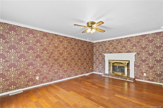 741 Ashboro St, Fayetteville, NC 28311 - unfurnished living room with wood finished floors, a ceiling fan, a fireplace, and baseboards