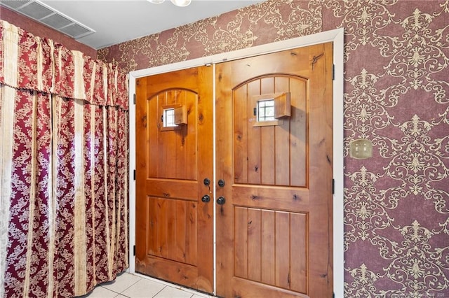 741 Ashboro St, Fayetteville, NC 28311 - foyer featuring wallpapered walls and light tile patterned floors