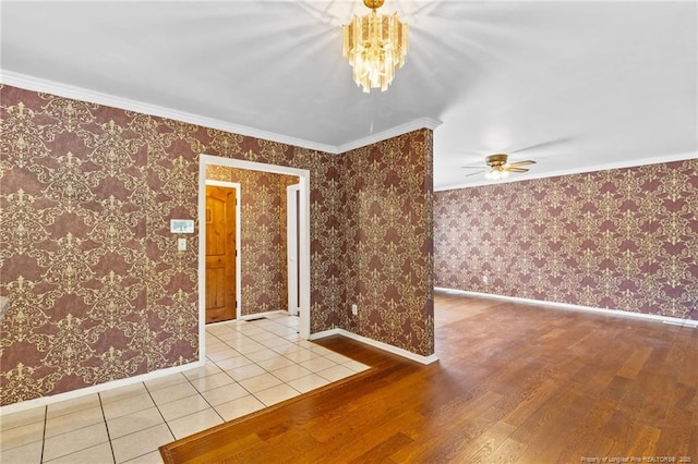 741 Ashboro St, Fayetteville, NC 28311 - unfurnished room featuring a chandelier, wood finished floors, baseboards, ceiling fan, and crown molding