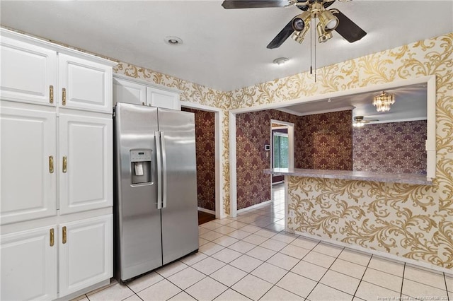 741 Ashboro St, Fayetteville, NC 28311 - kitchen featuring stainless steel fridge, wallpapered walls, light tile patterned flooring, ceiling fan, and white cabinets