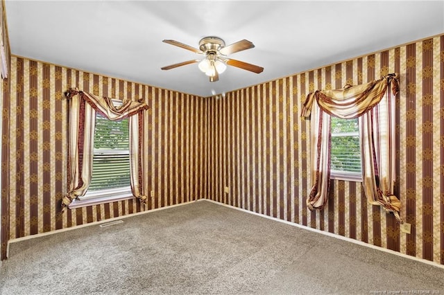 741 Ashboro St, Fayetteville, NC 28311 - carpeted empty room featuring ceiling fan and wallpapered walls