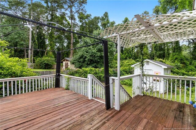 741 Ashboro St, Fayetteville, NC 28311 - wooden deck with view of scattered trees