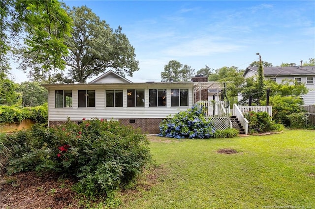 741 Ashboro St, Fayetteville, NC 28311 - rear view of house with stairs, a yard, crawl space, a sunroom, and a wooden deck