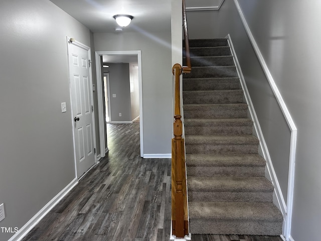 1527 Haywards Heath Ln, Apex, NC 27502 - stairs with wood finished floors and baseboards