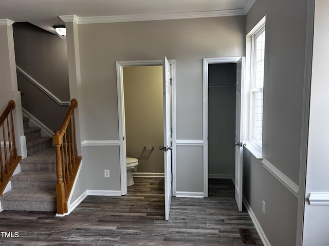 1527 Haywards Heath Ln, Apex, NC 27502 - staircase with wood finished floors, baseboards, and ornamental molding