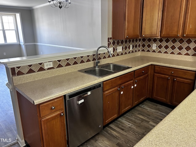 1527 Haywards Heath Ln, Apex, NC 27502 - kitchen featuring dishwasher, a sink, dark wood-style floors, light countertops, and decorative backsplash
