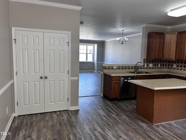 1527 Haywards Heath Ln, Apex, NC 27502 - kitchen featuring dishwashing machine, a sink, a chandelier, ornamental molding, and light countertops