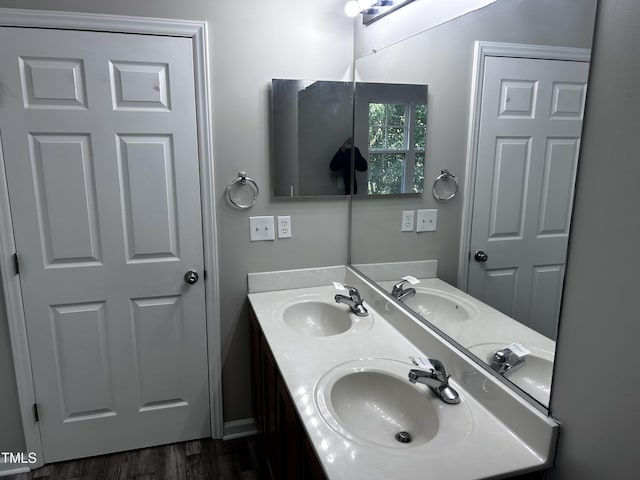 1527 Haywards Heath Ln, Apex, NC 27502 - full bathroom featuring double vanity and wood finished floors