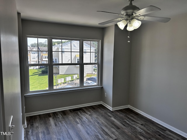 1527 Haywards Heath Ln, Apex, NC 27502 - unfurnished room featuring healthy amount of natural light, dark wood-type flooring, a ceiling fan, and baseboards