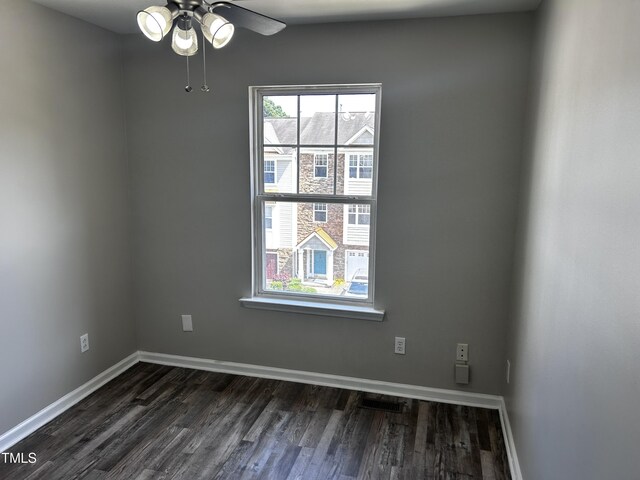 1527 Haywards Heath Ln, Apex, NC 27502 - spare room with dark wood-style floors, a ceiling fan, and baseboards