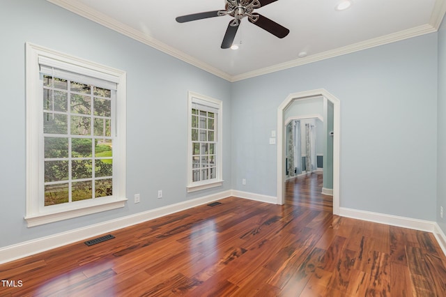 7604 Copper Creek Ct, Wake Forest, NC 27587 - empty room with baseboards, crown molding, wood finished floors, ceiling fan, and arched walkways