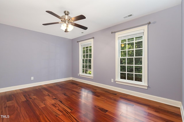 7604 Copper Creek Ct, Wake Forest, NC 27587 - unfurnished room with baseboards, plenty of natural light, and dark wood-type flooring