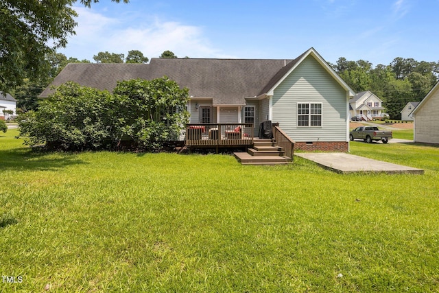 106 Oak Rd, Butner, NC 27509 - back of property featuring a deck, crawl space, a yard, and roof with shingles