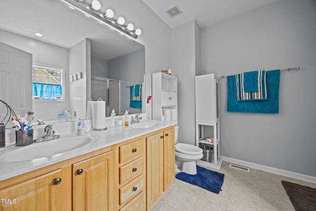 106 Oak Rd, Butner, NC 27509 - full bath featuring double vanity, a stall shower, toilet, tile patterned floors, and baseboards