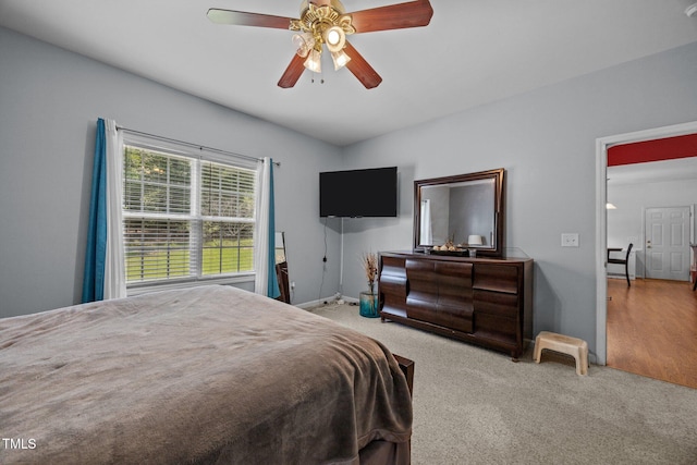 106 Oak Rd, Butner, NC 27509 - bedroom with carpet floors, a ceiling fan, and baseboards