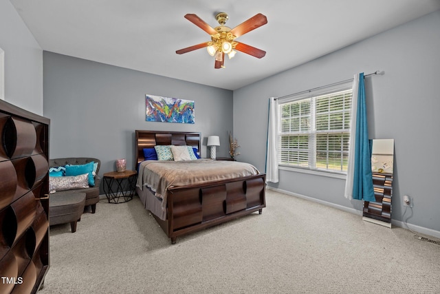 106 Oak Rd, Butner, NC 27509 - carpeted bedroom with baseboards and a ceiling fan