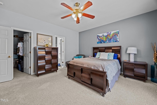 106 Oak Rd, Butner, NC 27509 - carpeted bedroom with a walk in closet, a closet, ceiling fan, and baseboards