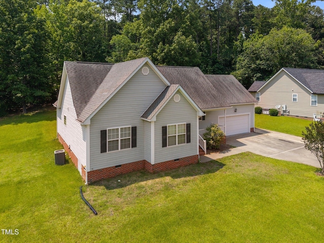 106 Oak Rd, Butner, NC 27509 - view of front of property featuring crawl space, concrete driveway, an attached garage, roof with shingles, and central AC unit
