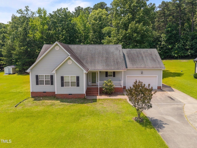 106 Oak Rd, Butner, NC 27509 - view of front of home with crawl space, covered porch, concrete driveway, a garage, and a front yard