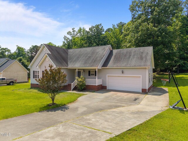 106 Oak Rd, Butner, NC 27509 - view of front facade featuring a porch, an attached garage, a front yard, and concrete driveway