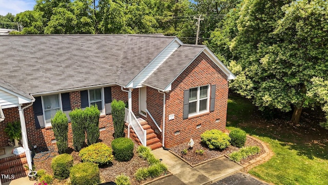 1731 Malone Rd Unit A, Burlington, NC 27215 - view of front facade with brick siding, roof with shingles, and crawl space