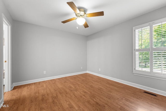 1731 Malone Rd Unit A, Burlington, NC 27215 - unfurnished room with light wood-style floors, baseboards, and a ceiling fan