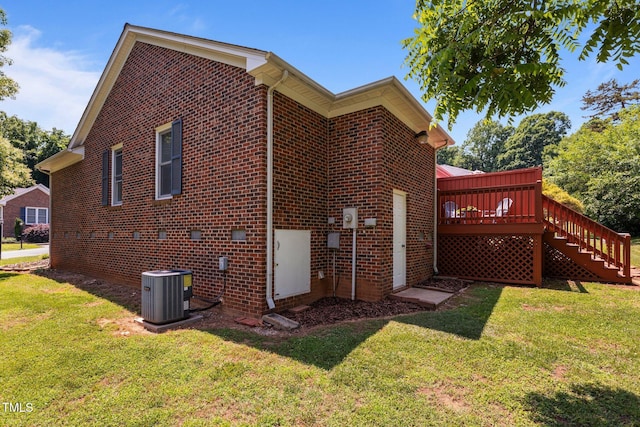 1731 Malone Rd Unit A, Burlington, NC 27215 - view of property exterior with brick siding, stairs, a deck, a yard, and central AC unit