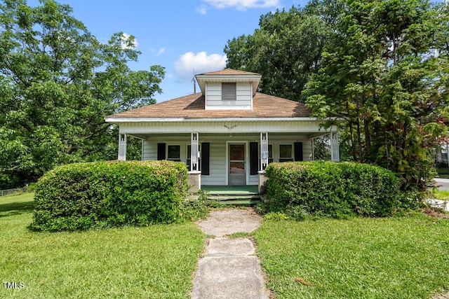 2631 Harvard Ave, Durham, NC 27703 - bungalow-style house featuring a front yard and covered porch