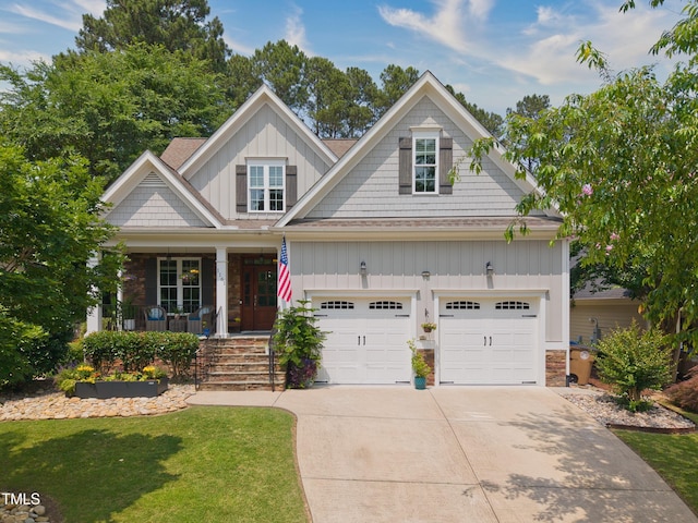 1161 Golden Star Way, Wake Forest, NC 27587 - craftsman-style home featuring board and batten siding, a porch, concrete driveway, stone siding, and a garage