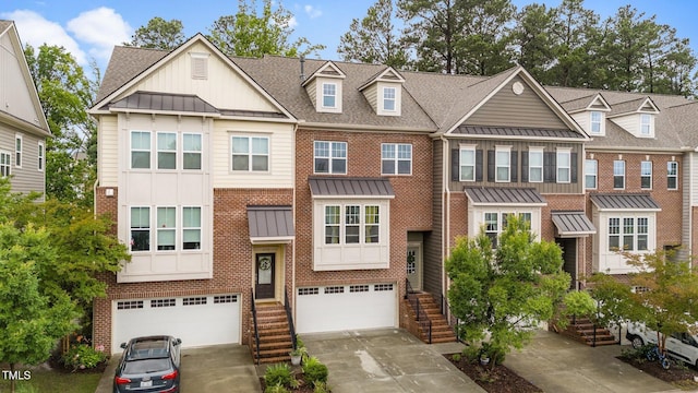 5321 Cambridgeshire Loop, Cary, NC 27519 - multi unit property with a standing seam roof, brick siding, and an attached garage