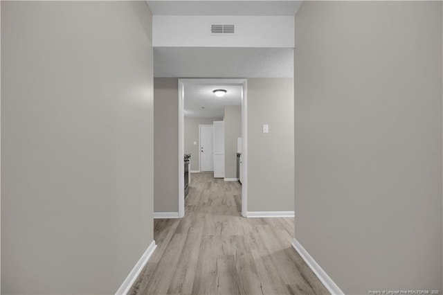 6263 Stoney Point Loop, Fayetteville, NC 28306 - hallway featuring light wood-style floors and baseboards