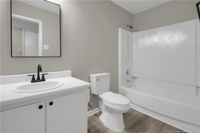 6263 Stoney Point Loop, Fayetteville, NC 28306 - bathroom with toilet,  shower combination, wood finished floors, vanity, and baseboards