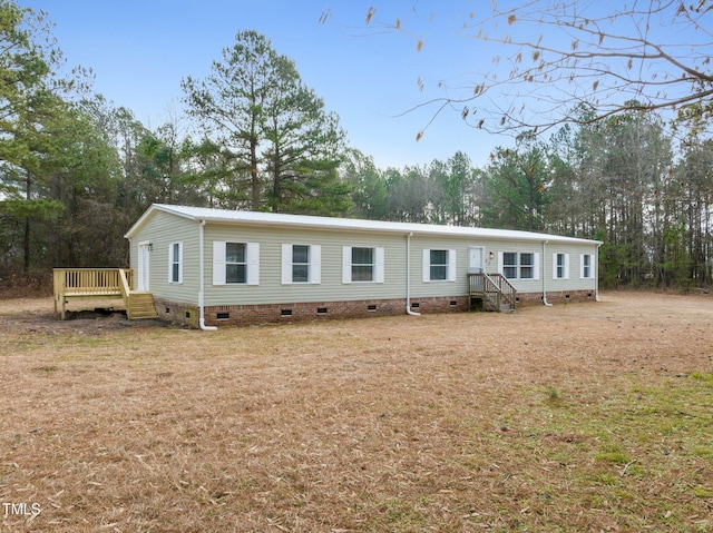 752 Dundee Cir, Raeford, NC 28376 - view of front of home with crawl space, a deck, view of scattered trees, and entry steps