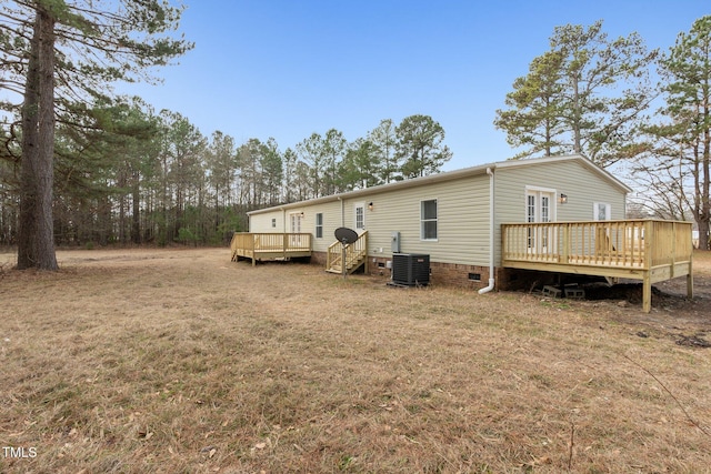752 Dundee Cir, Raeford, NC 28376 - rear view of house with a deck, cooling unit, crawl space, and a yard