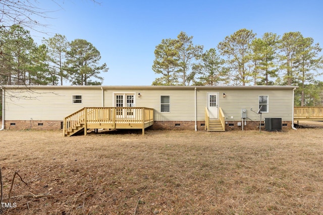 752 Dundee Cir, Raeford, NC 28376 - rear view of house with crawl space, entry steps, a wooden deck, central air condition unit, and a lawn