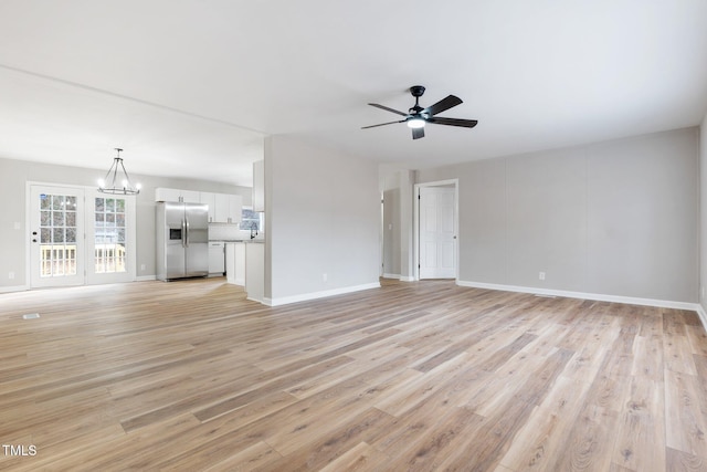 752 Dundee Cir, Raeford, NC 28376 - unfurnished living room with a ceiling fan, light wood finished floors, and baseboards