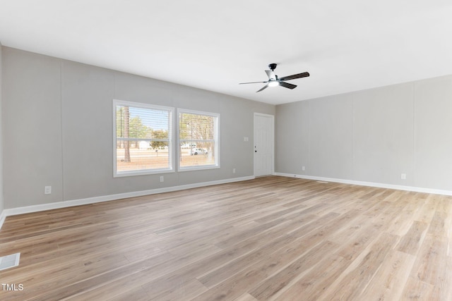 752 Dundee Cir, Raeford, NC 28376 - empty room featuring light wood-type flooring, a ceiling fan, and baseboards