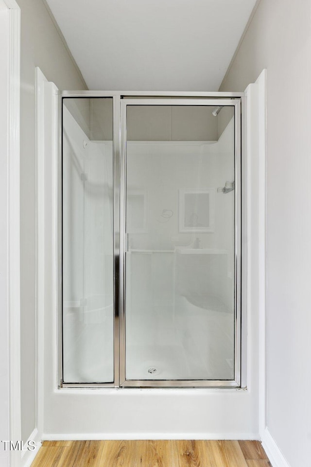 752 Dundee Cir, Raeford, NC 28376 - bathroom featuring a shower stall and wood finished floors