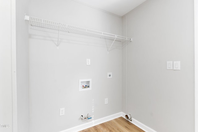 752 Dundee Cir, Raeford, NC 28376 - washroom featuring hookup for a gas dryer, light wood-style flooring, washer hookup, baseboards, and electric dryer hookup