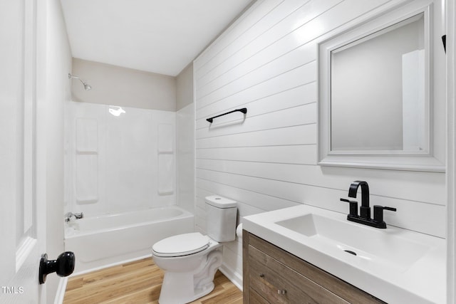 752 Dundee Cir, Raeford, NC 28376 - full bathroom featuring toilet, vanity, shower / bathtub combination, wood finished floors, and wood walls